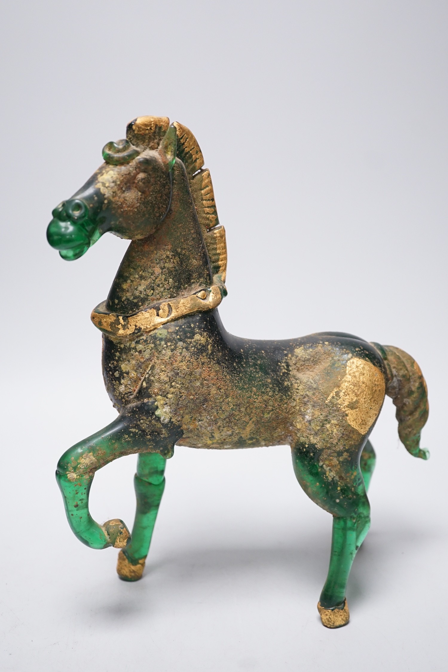 A Murano gilded glass model of the Lion of Venice, 21 cm long and a gilded green glass figure of a horse, 31cm